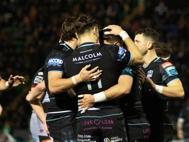 Glasgow Warriors' Facundo Cordero celebrates with Jamie Dobie (No 11) after scoring a second-half try against Dragons.