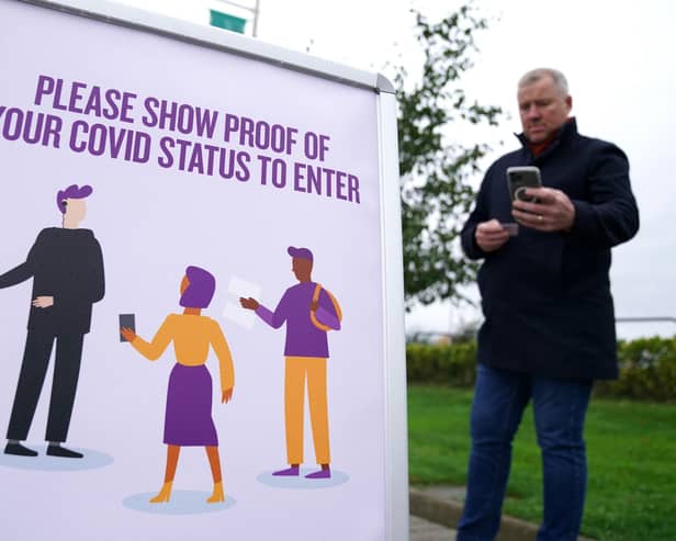 Jason Leitch has said the vaccine passport scheme should be reviewed in the light of the Omicron variant.