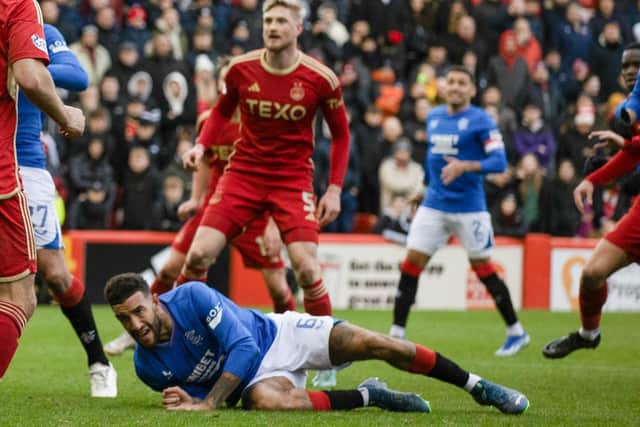 Rangers defender Connor Goldson goes down in the Aberdeen box after having his shirt pulled before he is awarded a penalty following a VAR check. (Photo by Craig Williamson / SNS Group)
