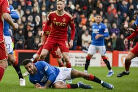 Rangers defender Connor Goldson goes down in the Aberdeen box after having his shirt pulled before he is awarded a penalty following a VAR check. (Photo by Craig Williamson / SNS Group)