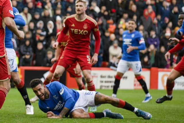 Rangers defender Connor Goldson goes down in the Aberdeen box after having his shirt pulled before he is awarded a penalty following a VAR check. (Photo by Craig Williamson / SNS Group)