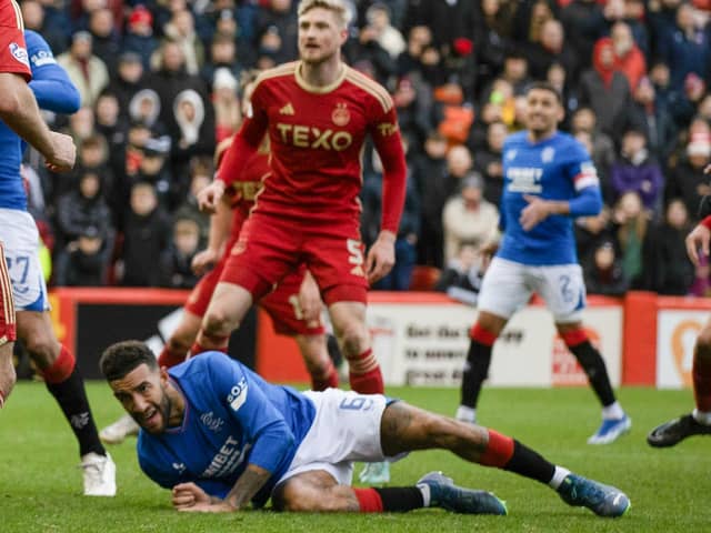 Rangers defender Connor Goldson goes down in the Aberdeen box after having his shirt pulled before he is awarded a penalty following a VAR check. (Photo by Craig Williamson / SNS Group)