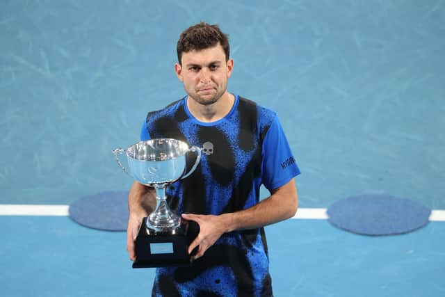 Aslan Karatsev of Russia celebrates with the trophy