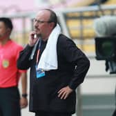 Dalian Pro coach Rafael Benitez (R) looks on during their Chinese Super League football match against Guangzhou R&F in Dalian, in China's northeast Liaoning province on August 16, 2020. (Photo by STR / AFP) / China OUT (Photo by STR/AFP via Getty Images)