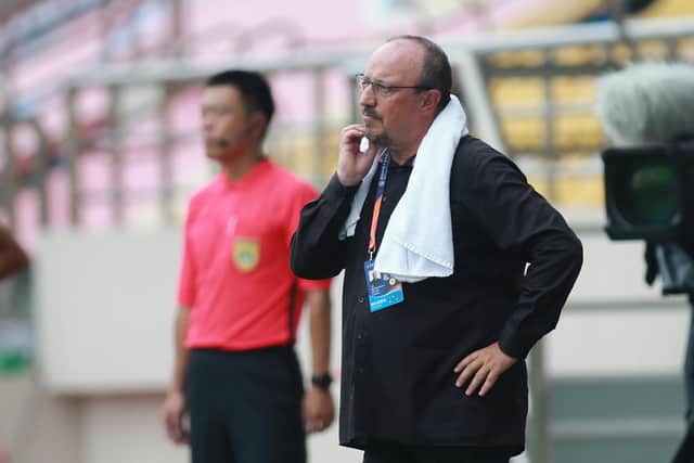 Dalian Pro coach Rafael Benitez (R) looks on during their Chinese Super League football match against Guangzhou R&F in Dalian, in China's northeast Liaoning province on August 16, 2020. (Photo by STR / AFP) / China OUT (Photo by STR/AFP via Getty Images)