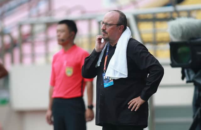Dalian Pro coach Rafael Benitez (R) looks on during their Chinese Super League football match against Guangzhou R&F in Dalian, in China's northeast Liaoning province on August 16, 2020. (Photo by STR / AFP) / China OUT (Photo by STR/AFP via Getty Images)