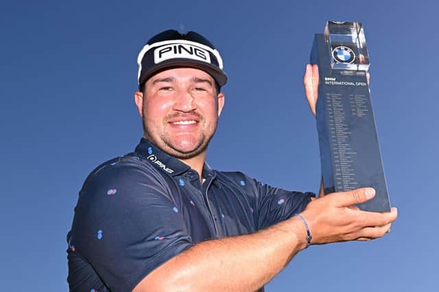Thriston Lawrence shows off the trophy after winning the BMW International Open at Golfclub Munchen Eichenried in Germany. Picture: Stuart Franklin/Getty Images.