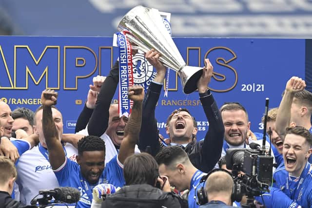 Rangers manager Steven Gerrard lifts the Premiership trophy during the Scottish Premiership match  between Rangers and Aberdeen  at Ibrox Stadium, on May 15, 2021, in Glasgow, Scotland. (Photo by Rob Casey / SNS Group)