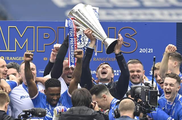 Rangers manager Steven Gerrard lifts the Premiership trophy during the Scottish Premiership match between Rangers and Aberdeen at Ibrox Stadium, on May 15, 2021, in Glasgow, Scotland. (Photo by Rob Casey / SNS Group)
