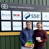 Jamie Kennedy pictured handing over his £10,000 cheque to Stephen Gallacher at Kingsfield Golf Centre near Linlithgow.