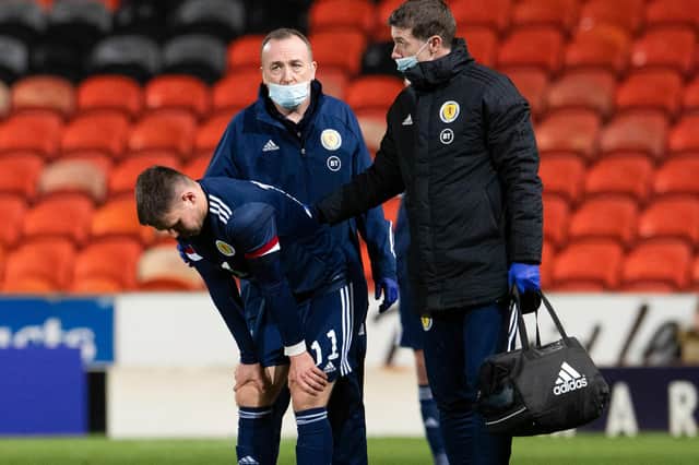 Scotland's Glenn Middleton pulls up with an injury during the Under 21 European Championship qualifier against Belgium. (Photo by Ross Parker / SNS Group)