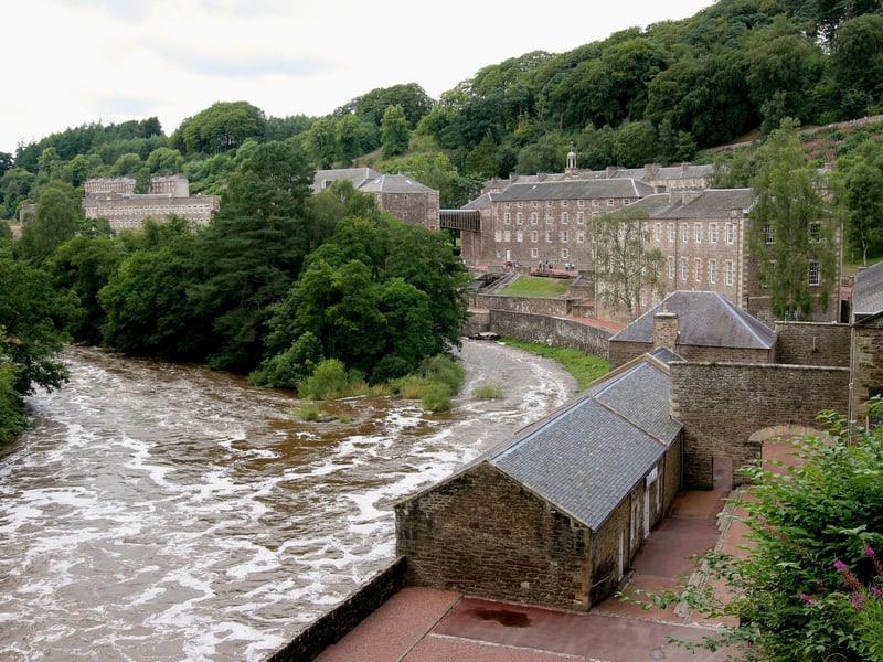 New Lanark Mill became a UNESCO World Heritage site in 2001. It is a unique 18th-century cotton mill which is powered by water wheels; it operated between 1786 and 1968. Founded in 1785 by David Dale, it represents over 200 years of social history as the mill, located on the River Clyde where it could take advantage of the water supply, housed many generations of mill workers and it was considered one of the largest industrial groups in the world during the 19th century. Unlike many other businesses, the mill owners offered good living conditions to their workers and thus the heritage site enshrines their humanism.
