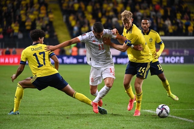 Rangers defender Filip Helander (right) holds off Manchester City striker Ferran Torres (centre) during Sweden's 2-1 World Cup qualiying win over Sweden in Stockholm on Thursday night. (Photo by JONATHAN NACKSTRAND/AFP via Getty Images)