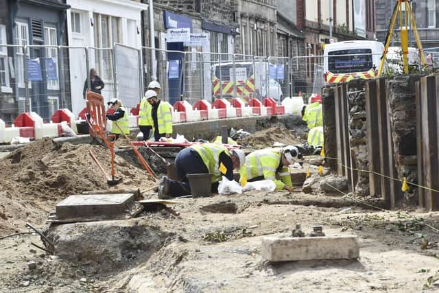 Archaeologists are on site outside South Leith Parish Church, where previous investigations have shown that in the medieval period the church's graveyard extended across the road with graves surviving beneath the current road surface.