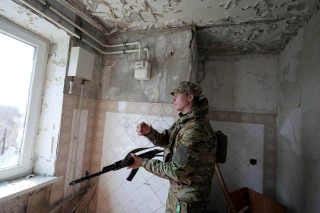 A Ukrainian soldier stands near the front line with Russia-backed separatists in the small town of Pisky, near Donetsk (Picture: Aleksey Filippov/AFP via Getty Images)
