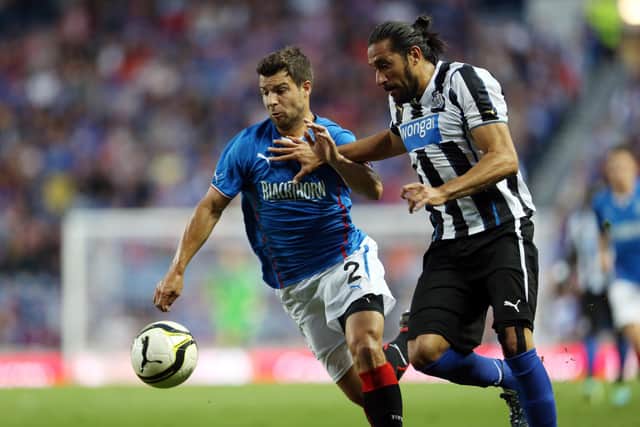 Playing for Rangers in a pre-season friendly against Newcastle United