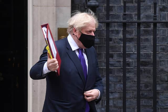 Boris Johnson wears a face mask as he leaves Downing Street (Picture: Peter Summers/Getty Images)