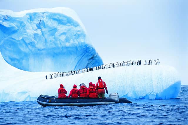 Tourists on the Antarctic Peninsula. Pic: PA Photo/Alamy.