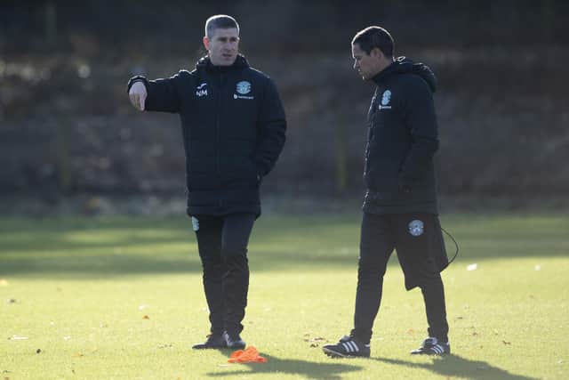 Hibs manager Nick Montgomery and his assistant Sergio Raimundo oversee training ahead of Saturday's match against Kilmarnock.