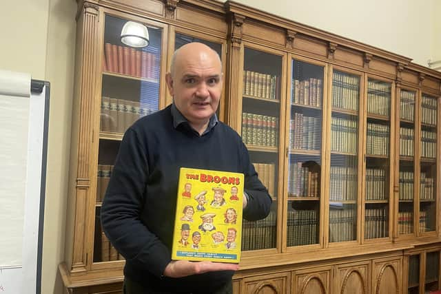 National Library curator Ian Scott with its newly-acquired first edition of The Broons annual.