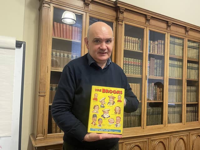 National Library curator Ian Scott with its newly-acquired first edition of The Broons annual.