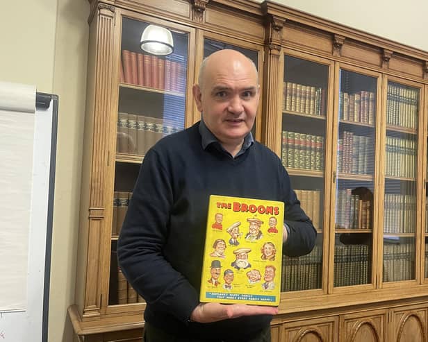 National Library curator Ian Scott with its newly-acquired first edition of The Broons annual.