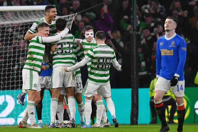 Celtic players celebrate after Reo Hatate scored his second goal in the 3-0 win over Rangers at Celtic Park in February. (Photo by Mark Runnacles/Getty Images).