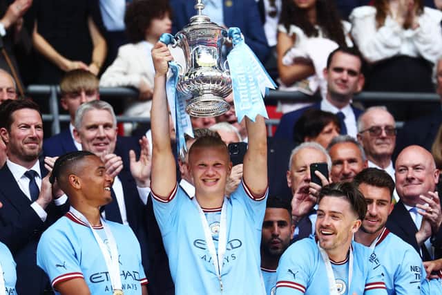 Erling Haaland lifts last season's FA Cup following Manchester City's victory over Manchester United in the final at Wembley. (Photo by Clive Rose/Getty Images)