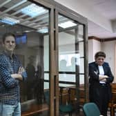 US journalist Evan Gershkovich, arrested on espionage charges, stands inside a defendants' cage before a hearing to consider an appeal on his arrest at the Moscow City Court earlier this week. Picture: AFP via Getty Images