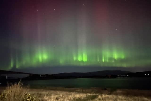 The Northern Lights over Kyleakin on the Isle of Skye. Issue date: Monday February 27, 2023. PA Photo. See PA story WEATHER Winter . Photo credit should read: @mrmcgrath12/Twitter/PA Wire