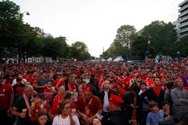 Liverpool FC's supporters gather near Place de la Nation in Paris on May 28, 2022, prior to the Champions League football match final between Liverpool FC and Real Madrid. (Photo by GEOFFROY VAN DER HASSELT/AFP via Getty Images)