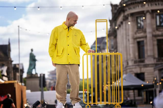 Artist Kostya Benkovich presents his sculpture The Suitcase at the Assembly Gardens in Edinburgh