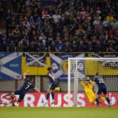 John McGinn scores Scotland's second goal against Austria in Vienna as he fires a shot beyond Daniel Bachmann. (Photo by Christian Hofer/Getty Images)