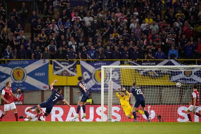 John McGinn scores Scotland's second goal against Austria in Vienna as he fires a shot beyond Daniel Bachmann. (Photo by Christian Hofer/Getty Images)