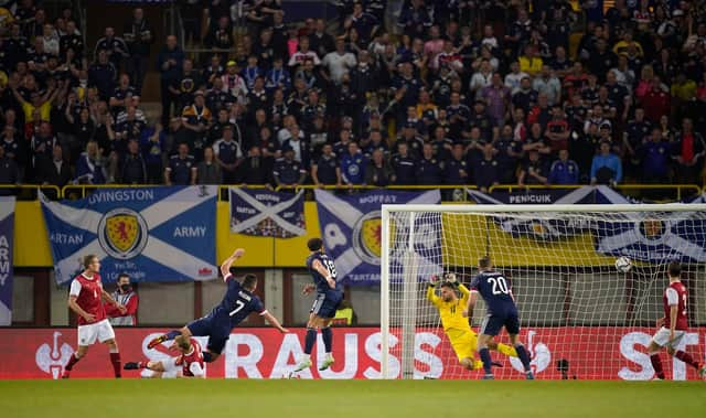 John McGinn scores Scotland's second goal against Austria in Vienna as he fires a shot beyond Daniel Bachmann. (Photo by Christian Hofer/Getty Images)