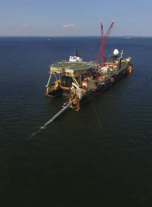 The Castoro 10 pipelay vessel lays concrete-coated pipe for the Nord Stream 2 gas pipeline onto the seabed of the Baltic Sea on August 16, 2018 near Lubmin, Germany. The Nord Stream 2 pipeline was ex[ected to transport Russian natural gas from Narva Bay in Russia to Greifswald in Germany, creating an additional, direct natural gas route between Russia and western Europe. Germany has halted the official certification process for the pipeline which is also the target of sanctions by the US.  (Photo by Sean Gallup/Getty Images)