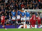 Trent Alexander-Arnold of Liverpool scores their team's first goal during the UEFA Champions League group A match between Liverpool FC and Rangers FC at Anfield on October 04, 2022 in Liverpool, England. (Photo by Clive Brunskill/Getty Images)