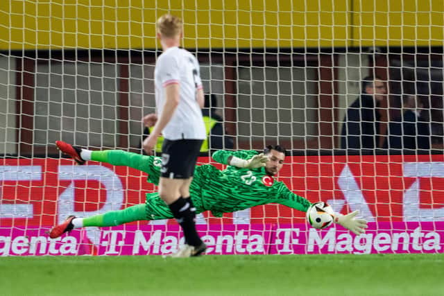 Celtic have been linked with Trabzonspor goalkeeper Ugurcan Cakir, pictured in action for Turkey against Austria last month. (Photo by GEORG HOCHMUTH/APA/AFP via Getty Images)