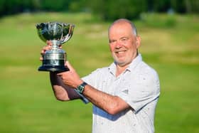 Erskine's Ronnie Clark shows off the trophy after his play-off win in the English Seniors' Stroke-Play Championship. Picture: England Golf.