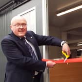 Allan Martin, the club’s former professional who has returned as its roving pro, cuts the ribbon to mark the official opening of the new clubhouse at Callander Golf Club. Picture: Callander Golf Club