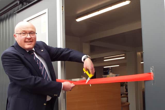 Allan Martin, the club’s former professional who has returned as its roving pro, cuts the ribbon to mark the official opening of the new clubhouse at Callander Golf Club. Picture: Callander Golf Club