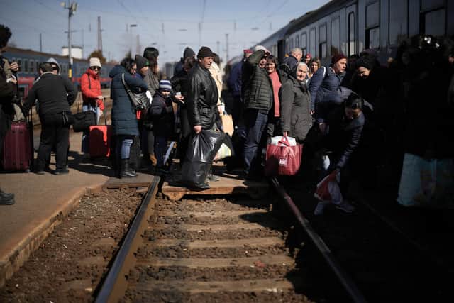 People queue to board a train back to Ukraine across the border from Hungary on March 12, 2022 in Zahony, Hungary. Picture: Christopher Furlong/Getty Images