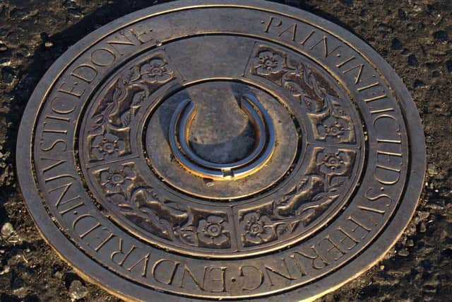In May 2008, a new horseshoe plaque was laid at Maxwellton crossing, located at the crossroads of Canal Street and Maxwellton Street, Paisley. It was designed by Scottish sculptor Sandy Stoddart in hopes of breathing new life into the town. The inscription reads: "Pain-Inflicted-Suffering-Endured-Injustice-Done."