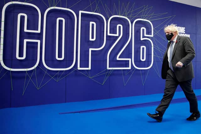 Prime Minister Boris Johnson arrives back at the COP26 summit - this time, having travelled by train. Picture: Phil Noble/PA Wire
