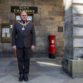 Edinburgh's Lord Provost Frank Ross observes the minute silence for the Duke of Edinburgh outside Edinburgh City Chambers on Saturday, April 17 (Photo: Lisa Ferguson).