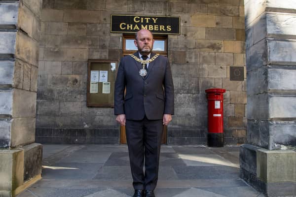 Edinburgh's Lord Provost Frank Ross observes the minute silence for the Duke of Edinburgh outside Edinburgh City Chambers on Saturday, April 17 (Photo: Lisa Ferguson).