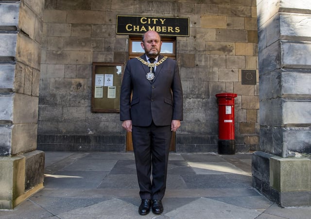 Edinburgh's Lord Provost Frank Ross observes the minute silence for the Duke of Edinburgh outside Edinburgh City Chambers on Saturday, April 17 (Photo: Lisa Ferguson).
