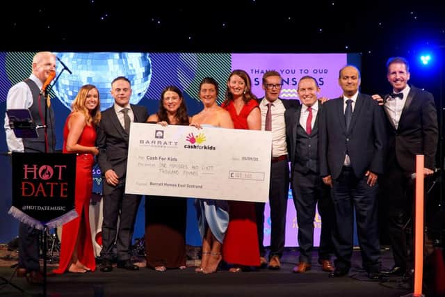 Barratt - Cash for Kids In order: Andrew Morrison, Vic Hendry, Duncan Martin, Paula Smith, Marion McGovern, Yvonne Barrie, Graeme Dunlop, Sam Embrey, Mansoor Ali, Garry Spence