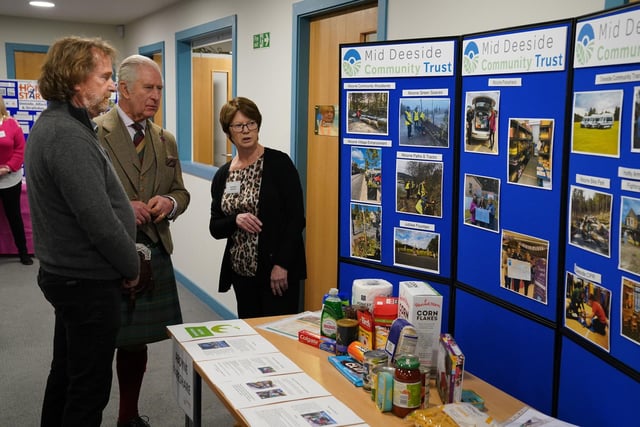 King Charles III learns about a number of community projects.