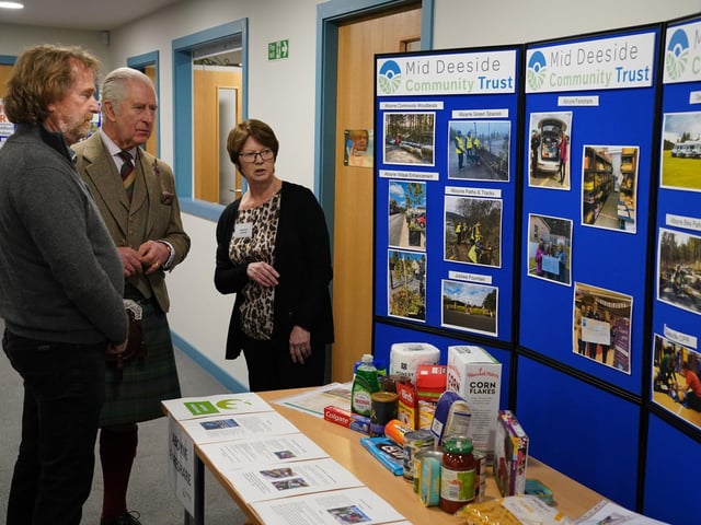 King Charles III learns about a number of community projects.